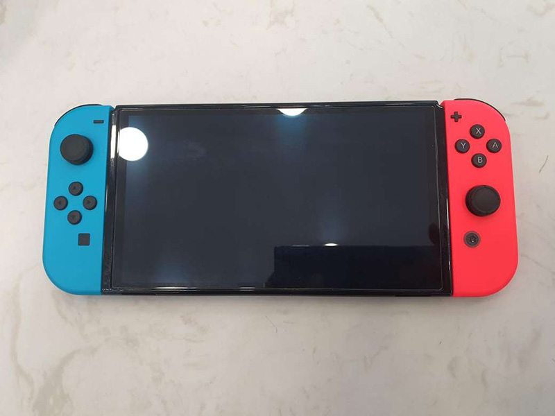 Nintendo Switch OLED model with White Joy‑Con